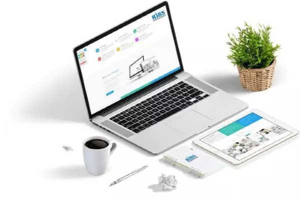 RIBS Technologies — laptop, tablet, and branded materials showcasing digital solutions